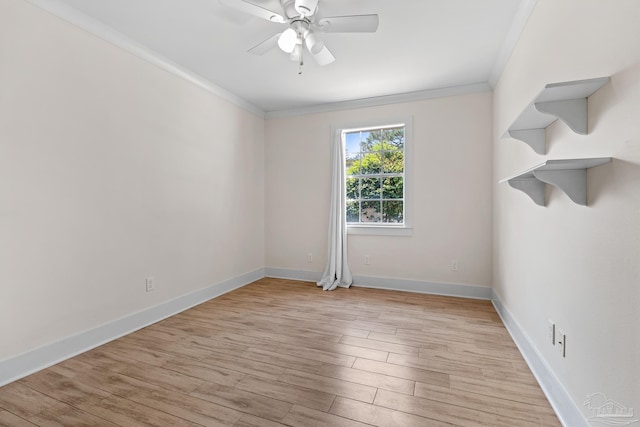 unfurnished room featuring light hardwood / wood-style floors, ornamental molding, and ceiling fan