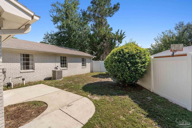 view of yard with a patio area and central AC