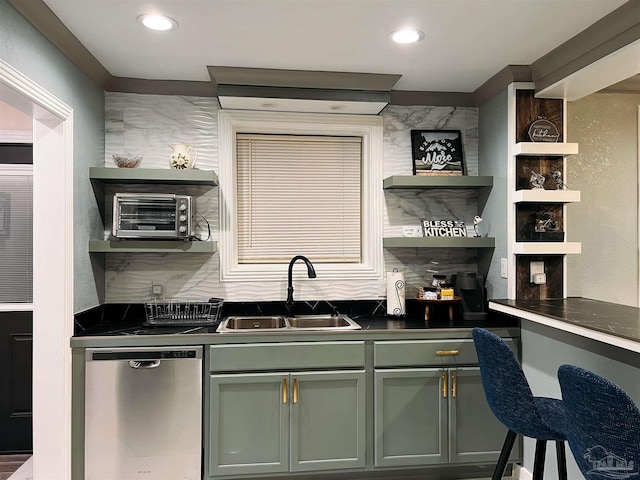 kitchen with stainless steel dishwasher, sink, and decorative backsplash