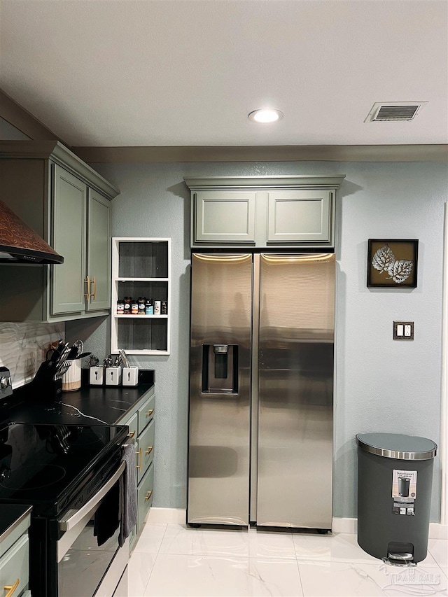 kitchen with double oven range, stainless steel fridge with ice dispenser, and light tile patterned floors