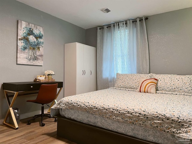 bedroom featuring light wood-type flooring