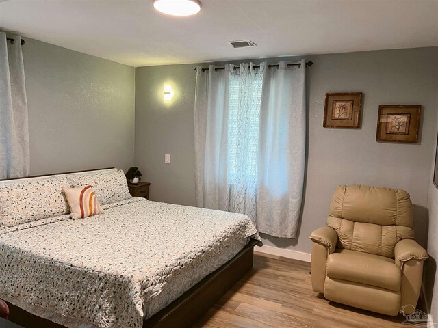 bedroom featuring light wood-type flooring