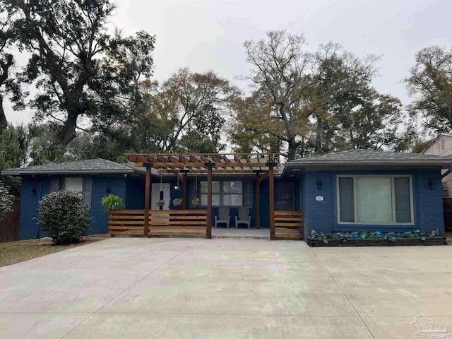 view of front of home with a pergola