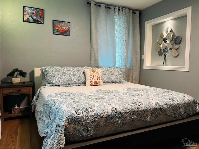 bedroom with wood-type flooring