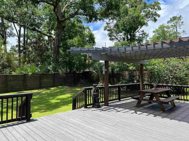 wooden terrace with a lawn and a pergola