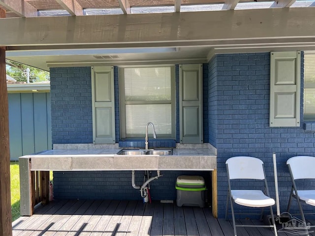 exterior space featuring a pergola and sink