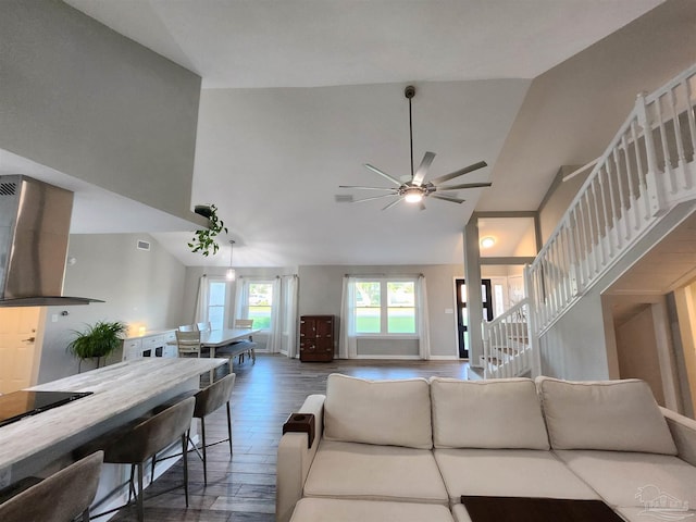 living room featuring ceiling fan, high vaulted ceiling, and dark hardwood / wood-style floors