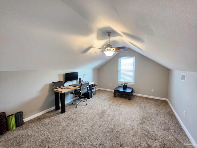 carpeted office space with ceiling fan, a textured ceiling, and vaulted ceiling