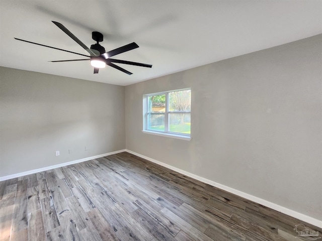 empty room featuring hardwood / wood-style flooring and ceiling fan