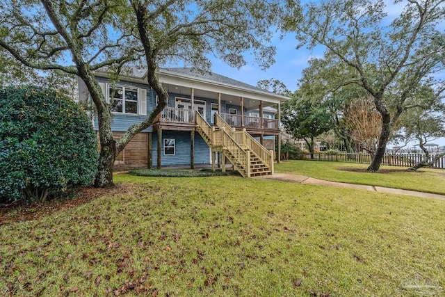 back of house with a lawn