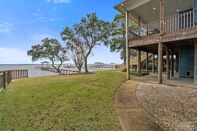 view of yard with a patio area and a water view