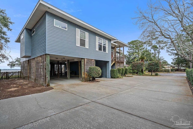 view of side of property with a carport