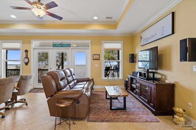 living room featuring ceiling fan, crown molding, french doors, and light tile patterned flooring