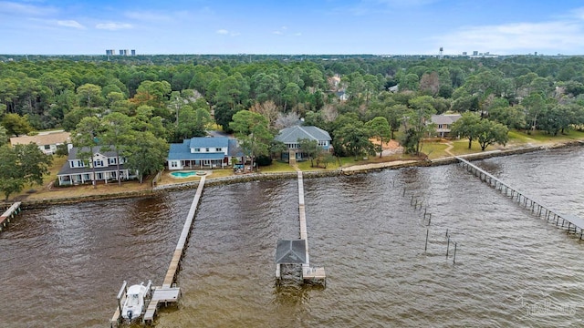 birds eye view of property with a water view