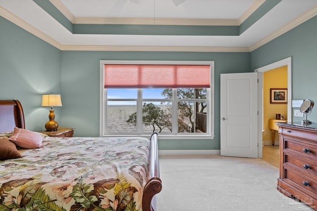 bedroom featuring light carpet, ceiling fan, crown molding, and a raised ceiling