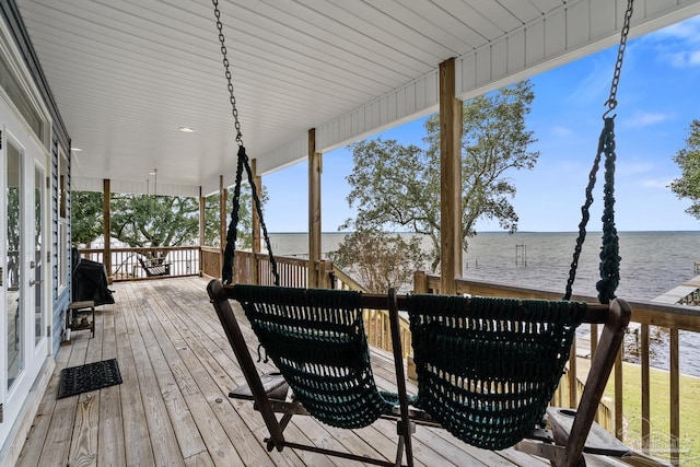 wooden terrace with a water view