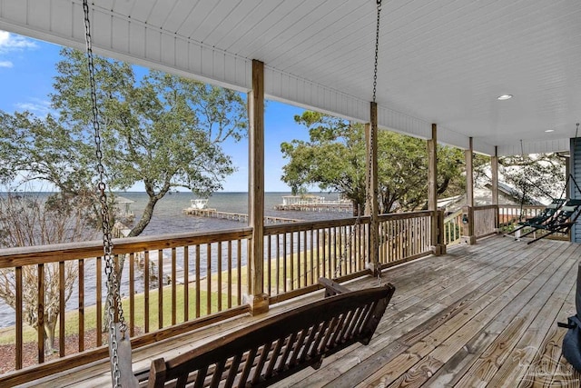 wooden deck with a water view