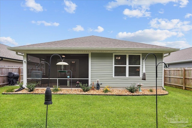 5451 Peach Dr, Pace, FL 32571 - back of property with a sunroom and a shingled roof