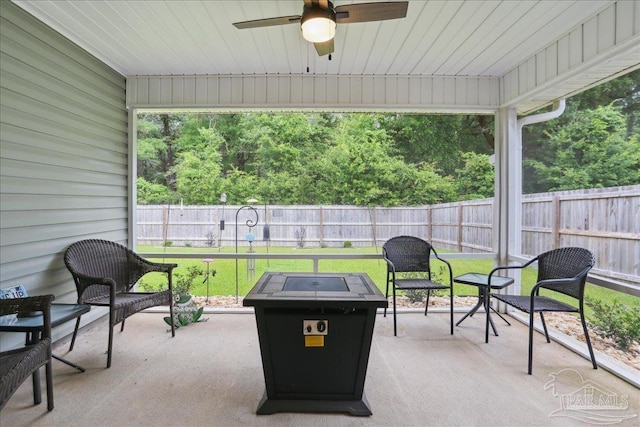 5451 Peach Dr, Pace, FL 32571 - fenced backyard with ceiling fan, a patio area, and a fire pit