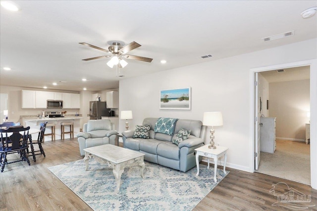 5451 Peach Dr, Pace, FL 32571 - living area with ceiling fan, light wood-style floors, and recessed lighting