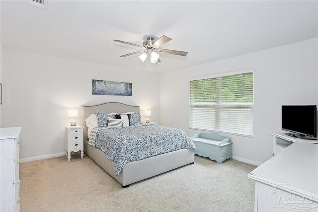 5451 Peach Dr, Pace, FL 32571 - bedroom with light colored carpet and ceiling fan