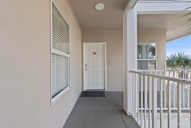 doorway to property featuring a balcony