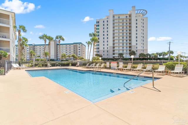 view of swimming pool with a patio