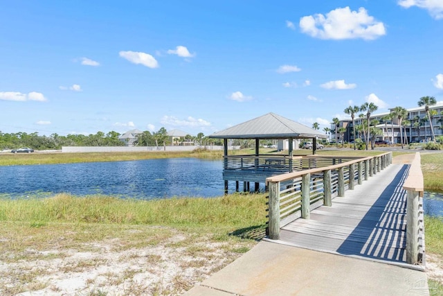 dock area with a gazebo and a water view