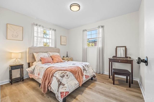 bedroom with light wood-type flooring