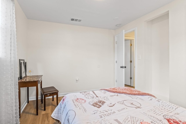 bedroom featuring hardwood / wood-style flooring