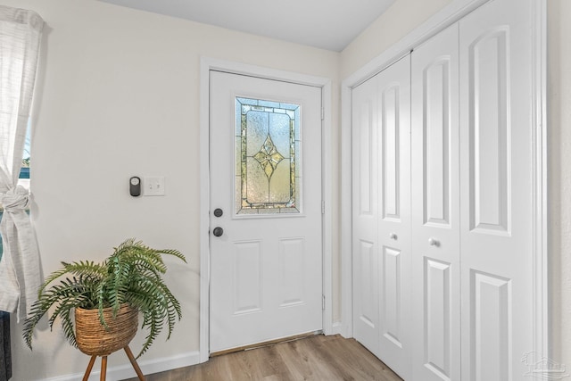 foyer entrance with light wood-type flooring