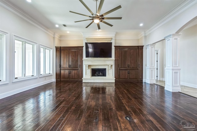 3995 W Madura Rd, Gulf Breeze, FL 32563 - unfurnished living room with ceiling fan, a fireplace, wood-type flooring, ornate columns, and visible vents