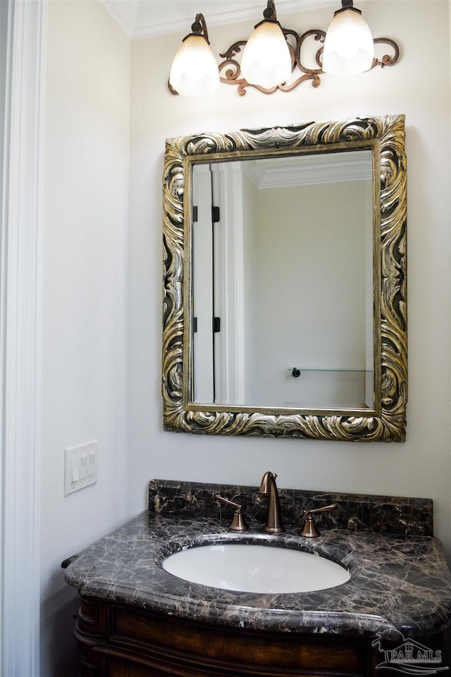 3995 W Madura Rd, Gulf Breeze, FL 32563 - bathroom featuring ornamental molding and vanity
