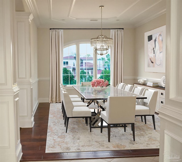 3995 W Madura Rd, Gulf Breeze, FL 32563 - dining area with a notable chandelier, ornamental molding, and dark wood finished floors