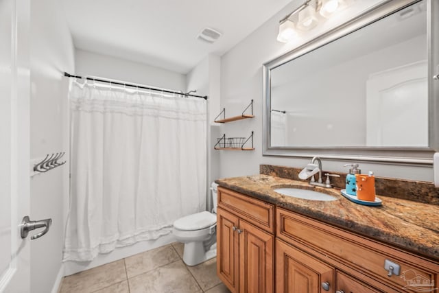 full bathroom with visible vents, vanity, toilet, and tile patterned floors