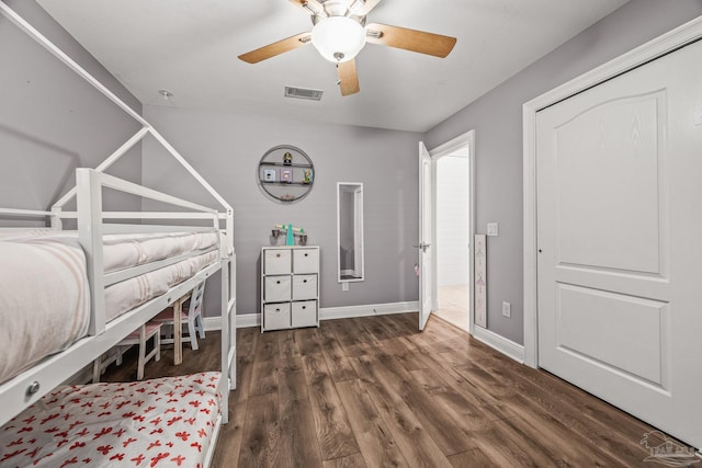 unfurnished bedroom featuring visible vents, ceiling fan, baseboards, and wood finished floors