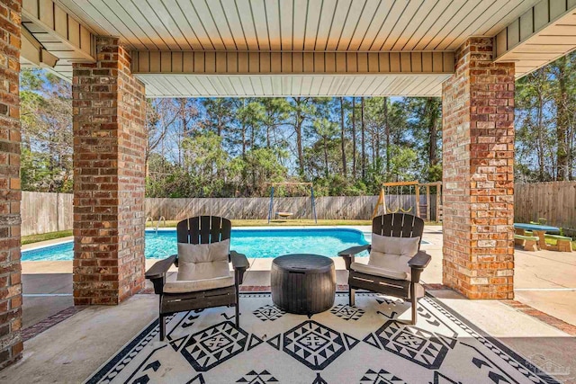 view of patio with a fenced backyard and a fenced in pool