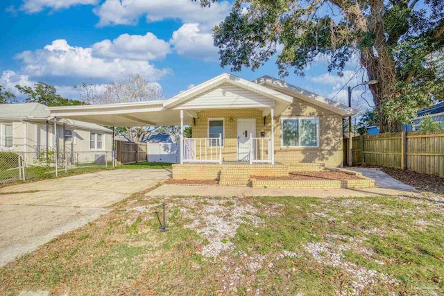 view of front of home featuring a carport and a porch