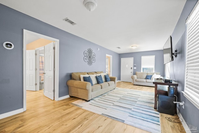 living room with light hardwood / wood-style flooring