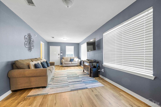 living room with light hardwood / wood-style flooring