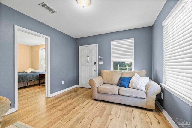 sitting room with light hardwood / wood-style flooring