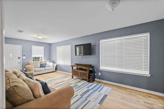 living room with light hardwood / wood-style flooring