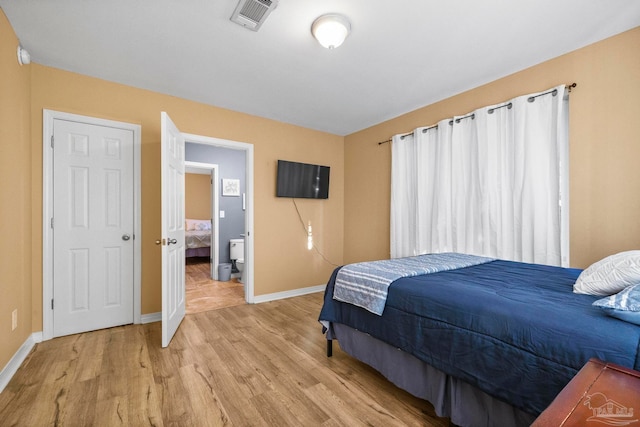 bedroom with light hardwood / wood-style flooring