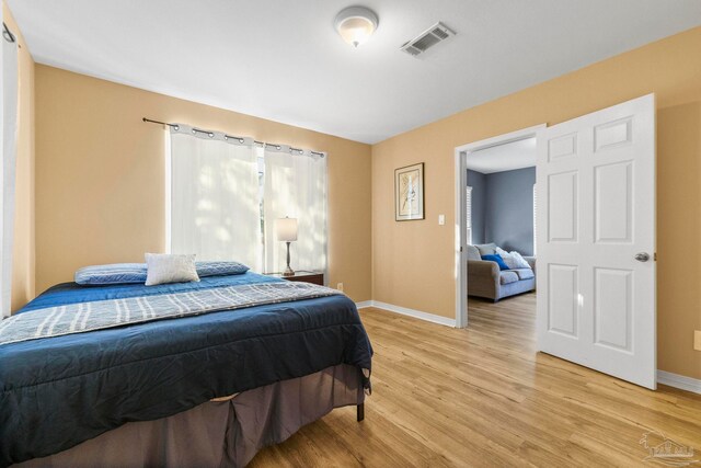 bedroom featuring light wood-type flooring