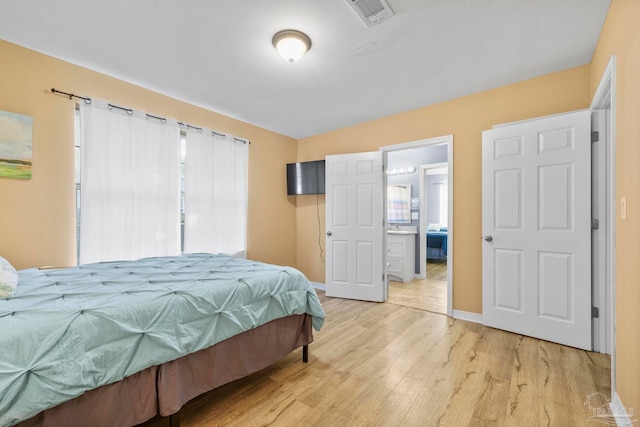 bedroom featuring light hardwood / wood-style floors