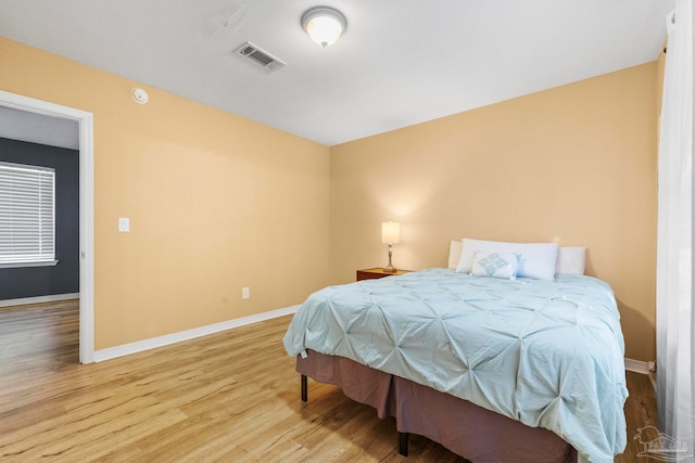 bedroom featuring wood-type flooring