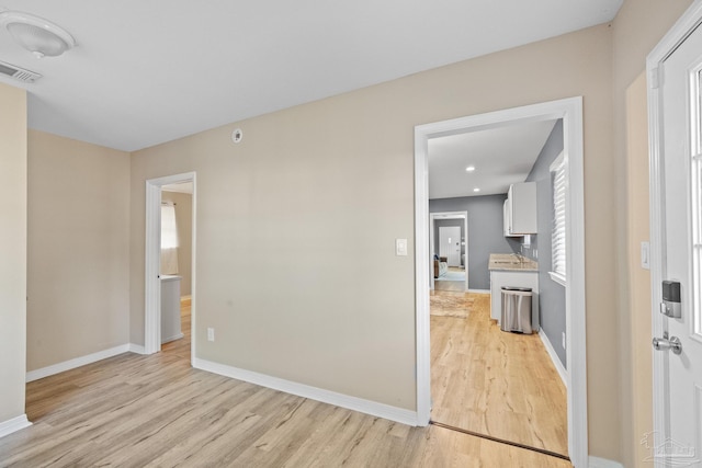 spare room with light wood-type flooring