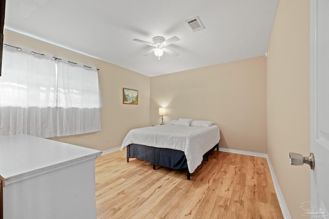 bedroom with ceiling fan and light wood-type flooring