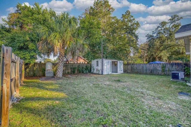 view of yard featuring cooling unit and a storage unit