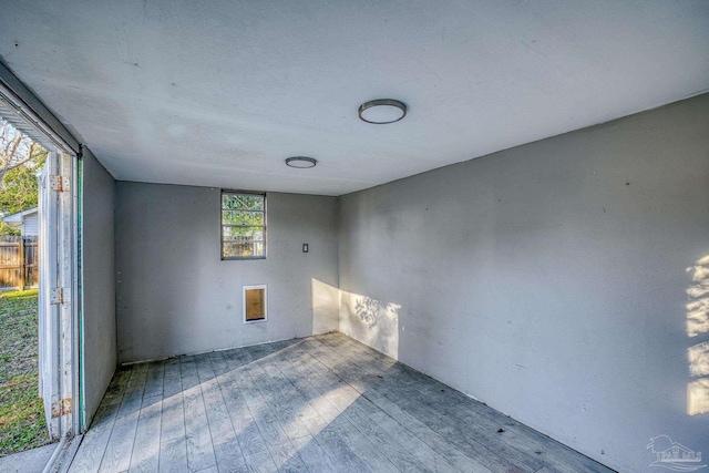 spare room featuring hardwood / wood-style flooring